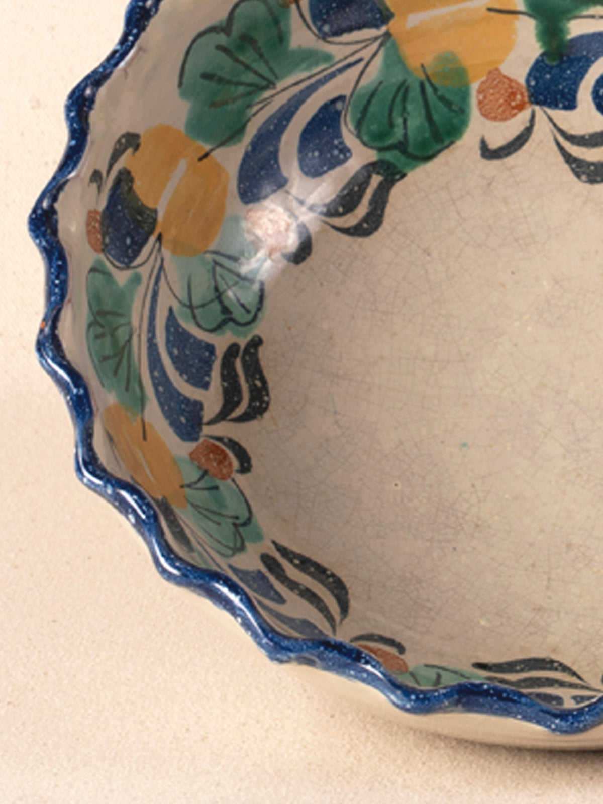 Vintage Mexican pottery bowl with a multicolor painted floral rim