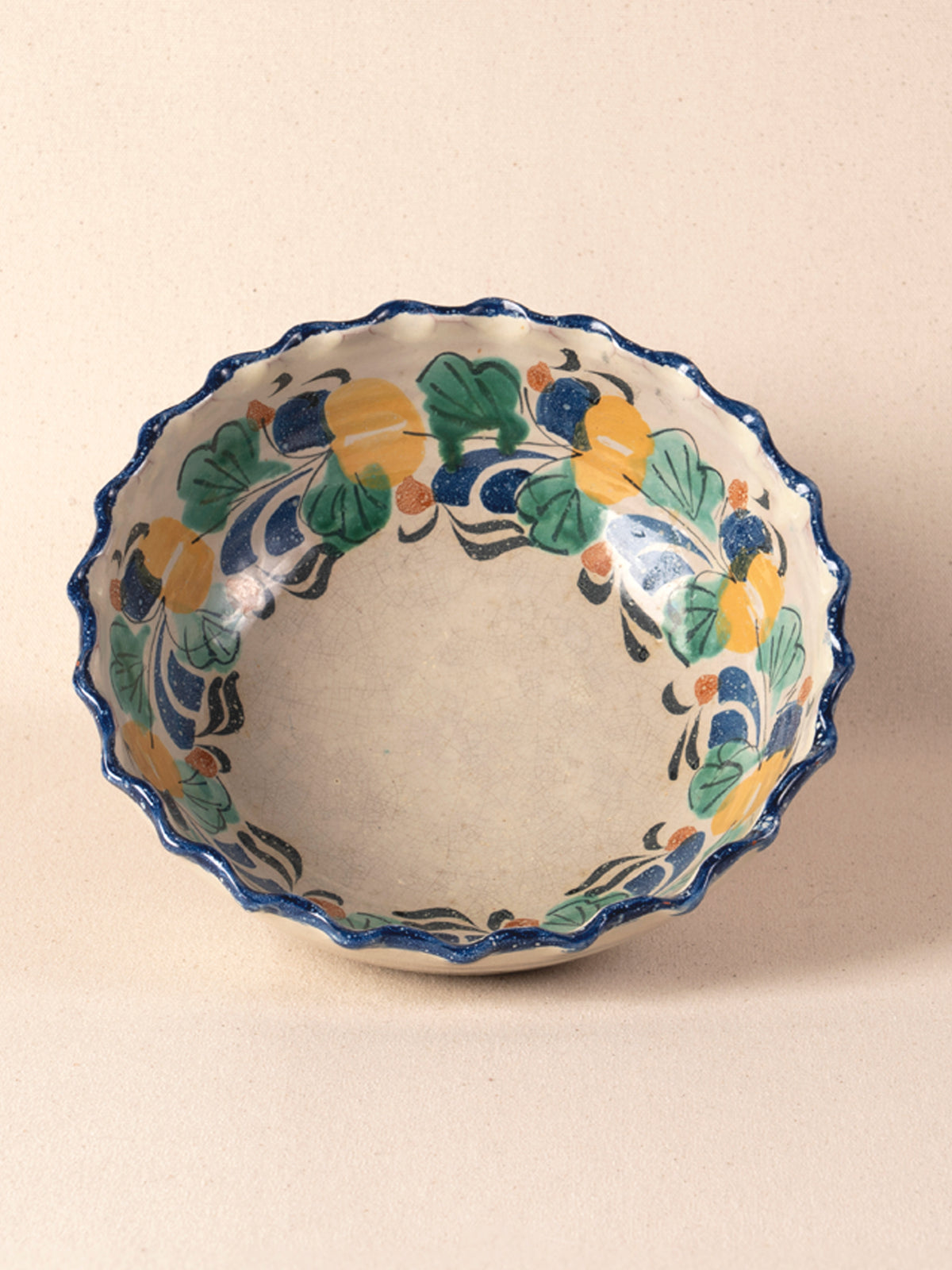 Vintage Mexican pottery bowl with a multicolor painted floral rim