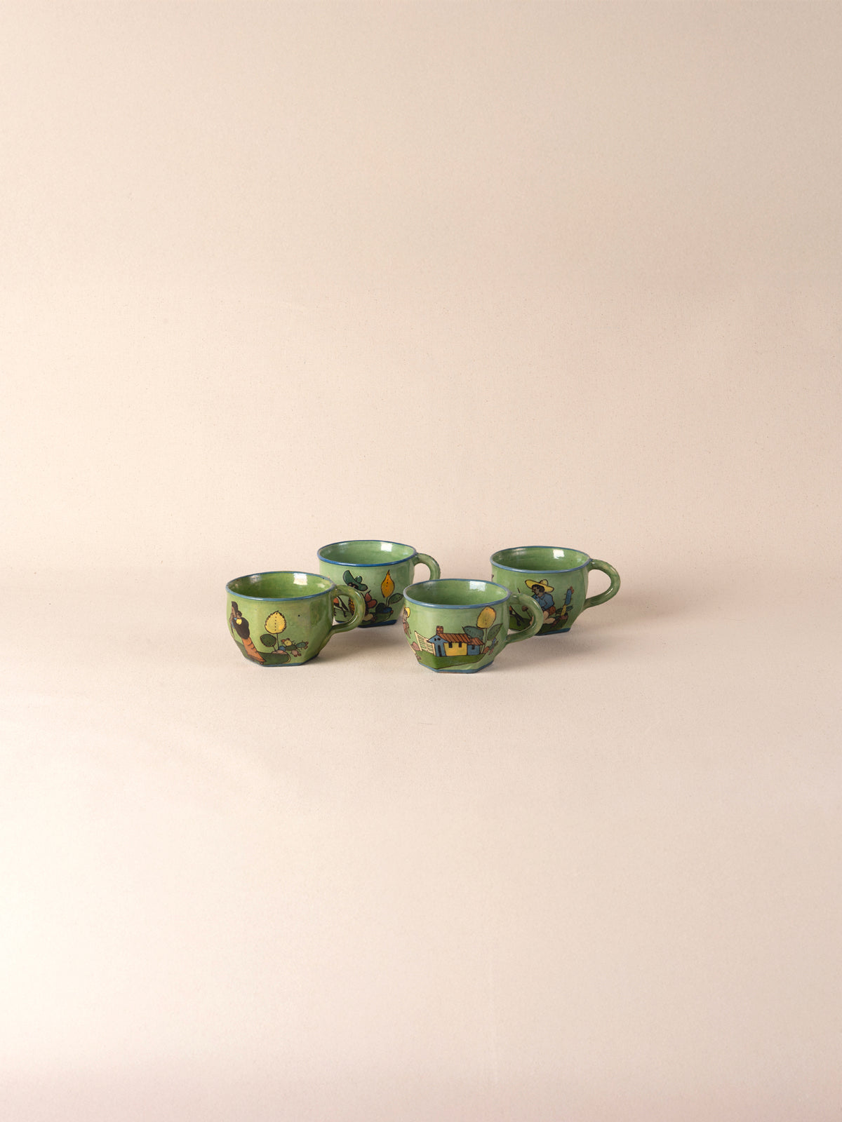 Set of four hand-painted vintage Mexican ceramic teacups in green
