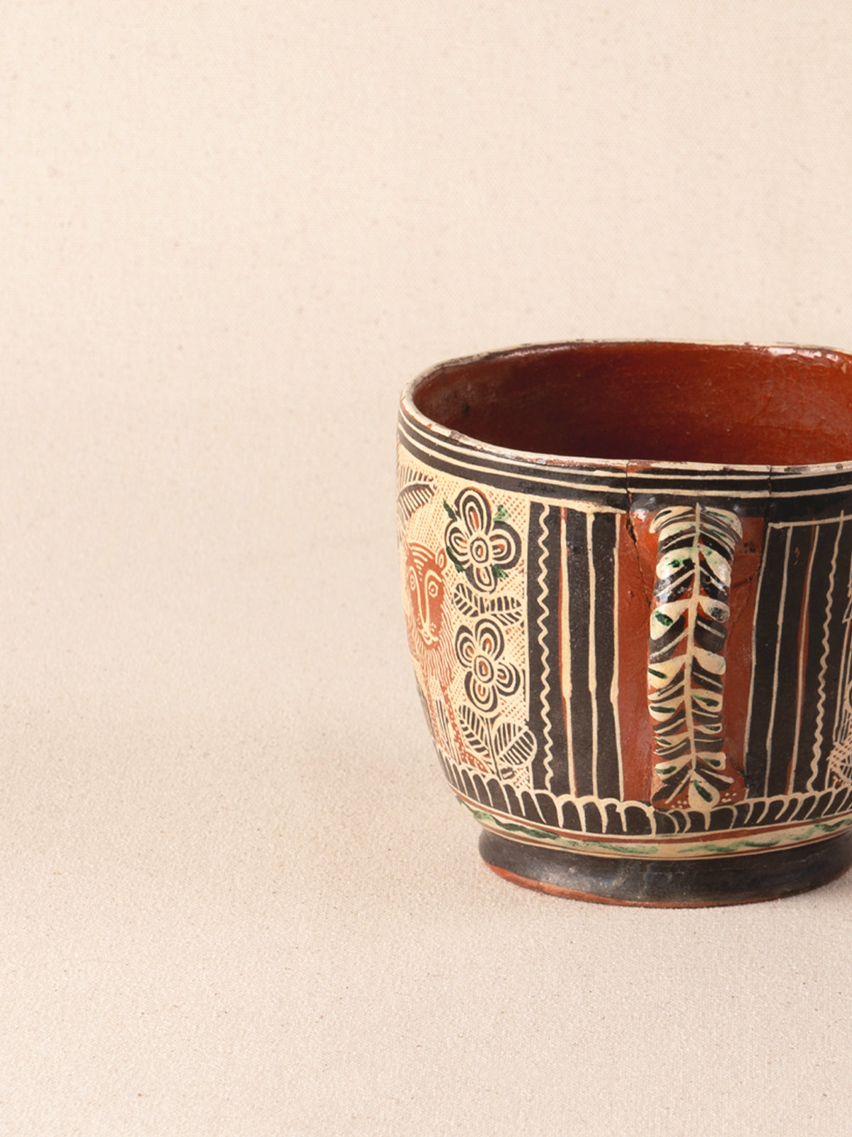 Vintage Mexican ceramic teacup with a painted lion motif