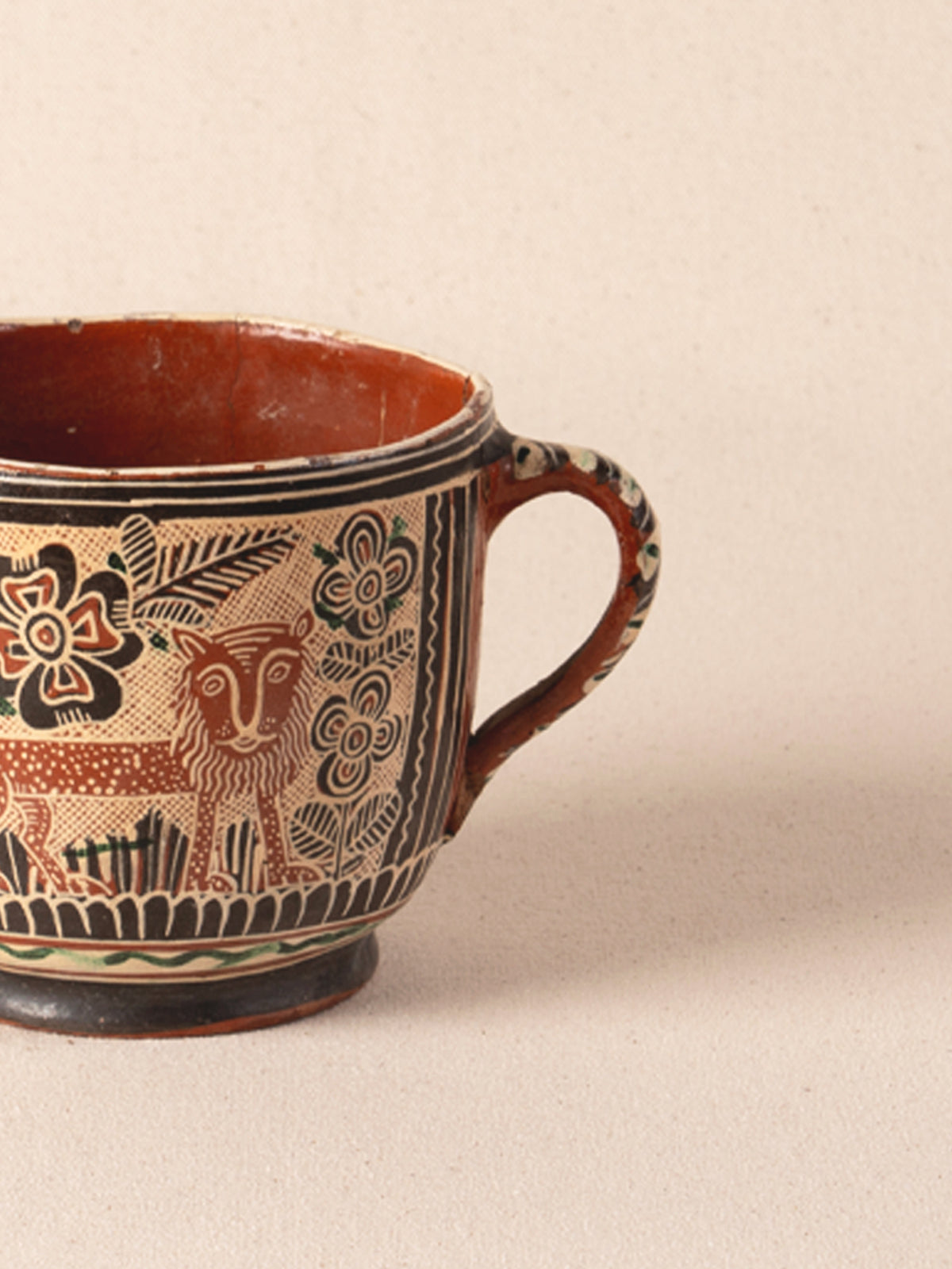 Vintage Mexican ceramic teacup with a painted lion motif