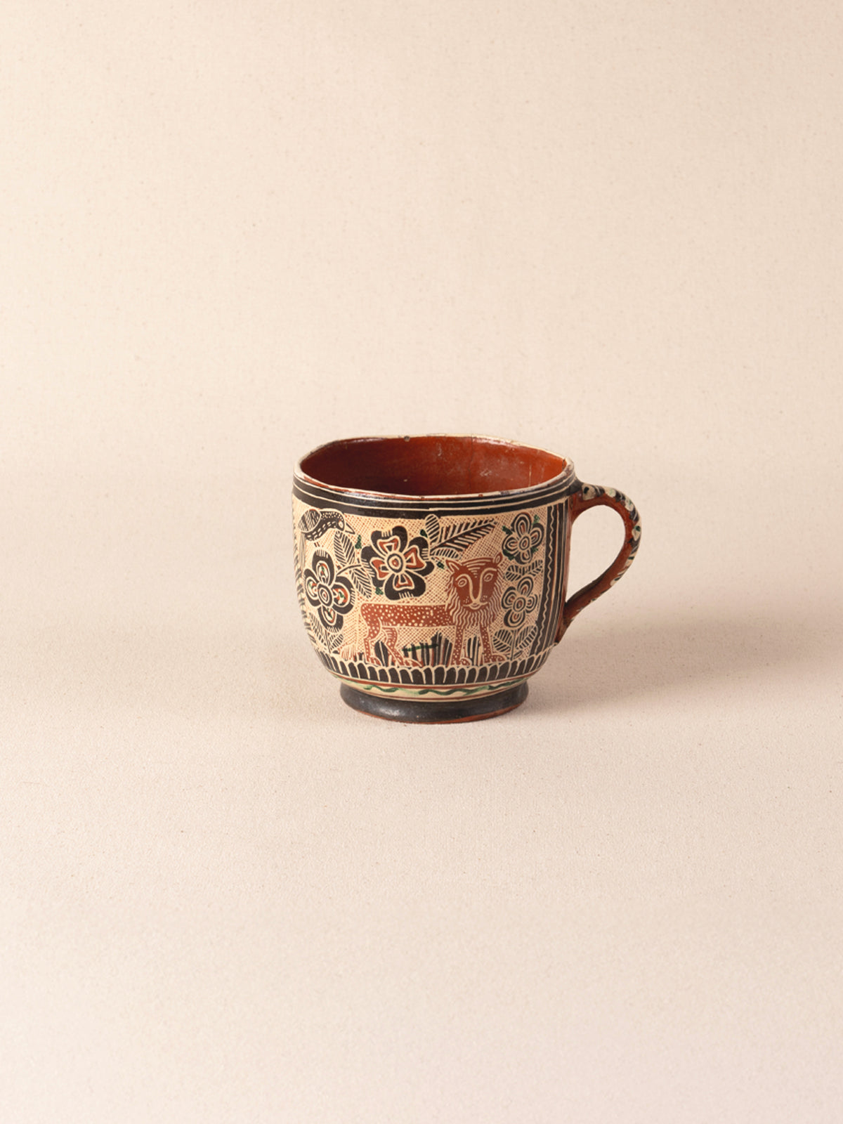Vintage Mexican ceramic teacup with a painted lion motif
