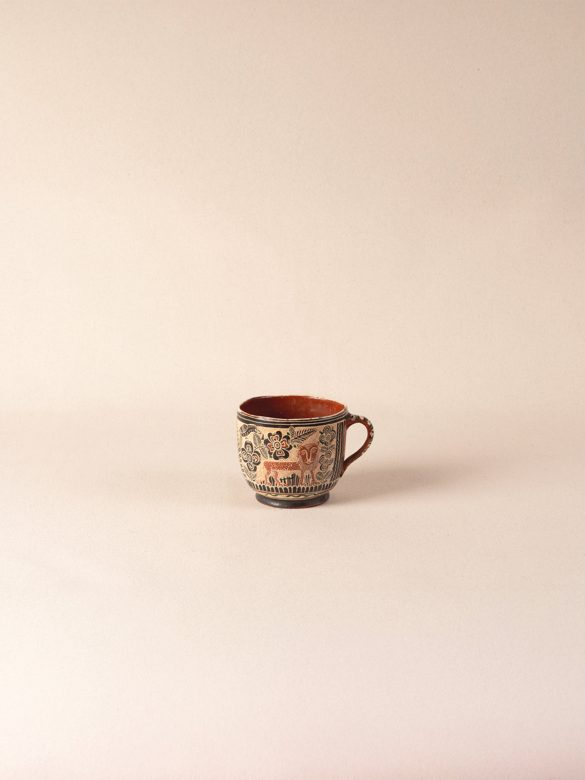 Vintage Mexican ceramic teacup with a painted lion motif