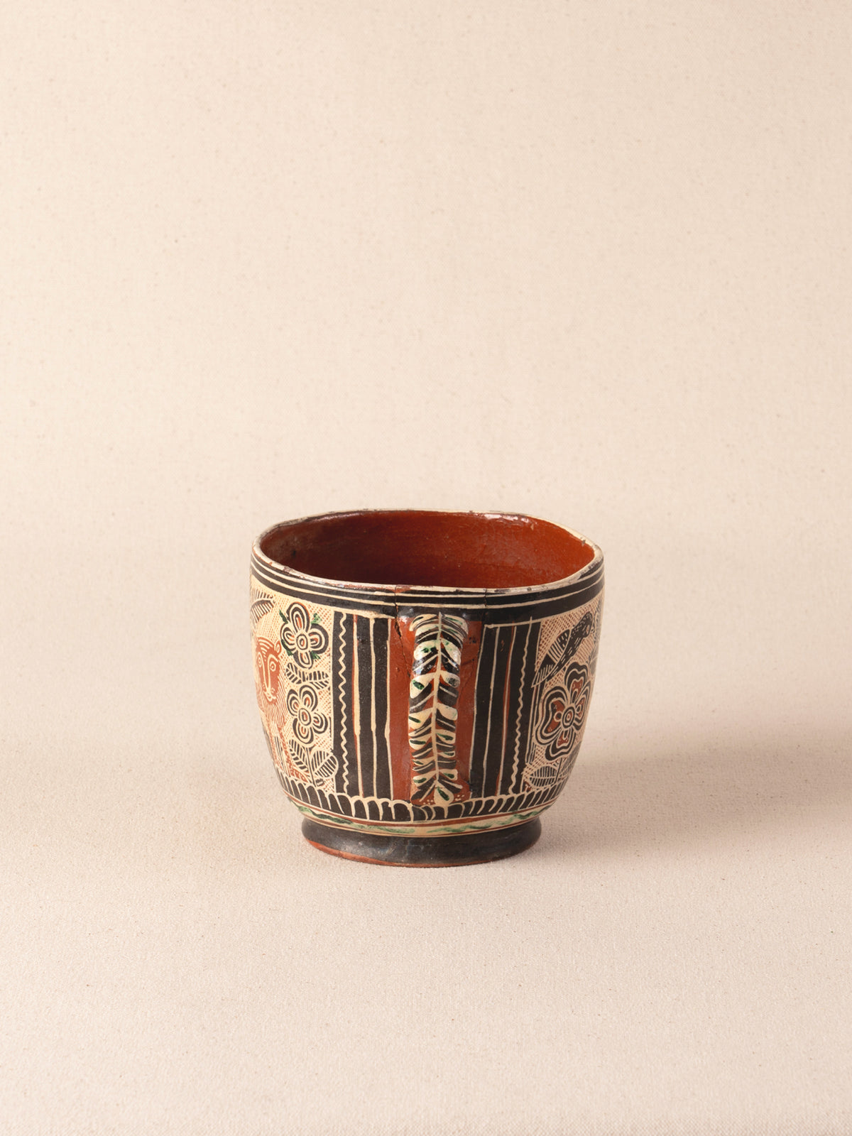Vintage Mexican ceramic teacup with a painted lion motif