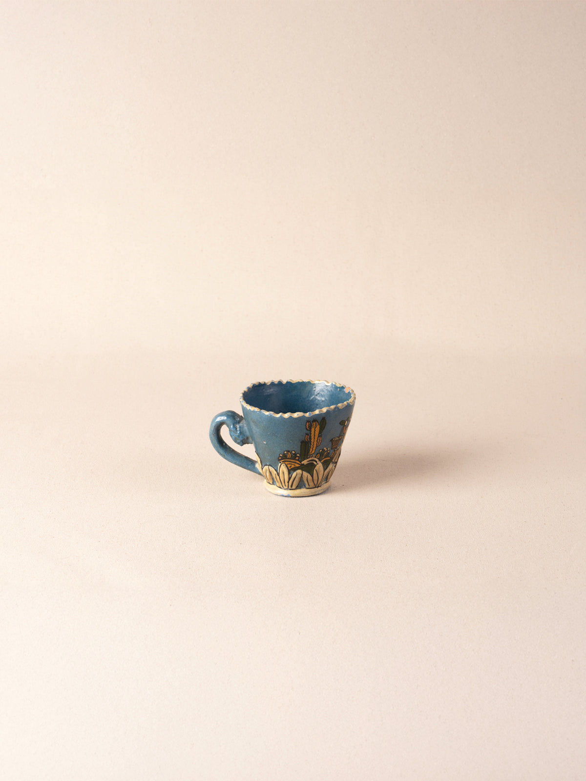 Hand-painted vintage Mexican ceramic teacup with blue decoration