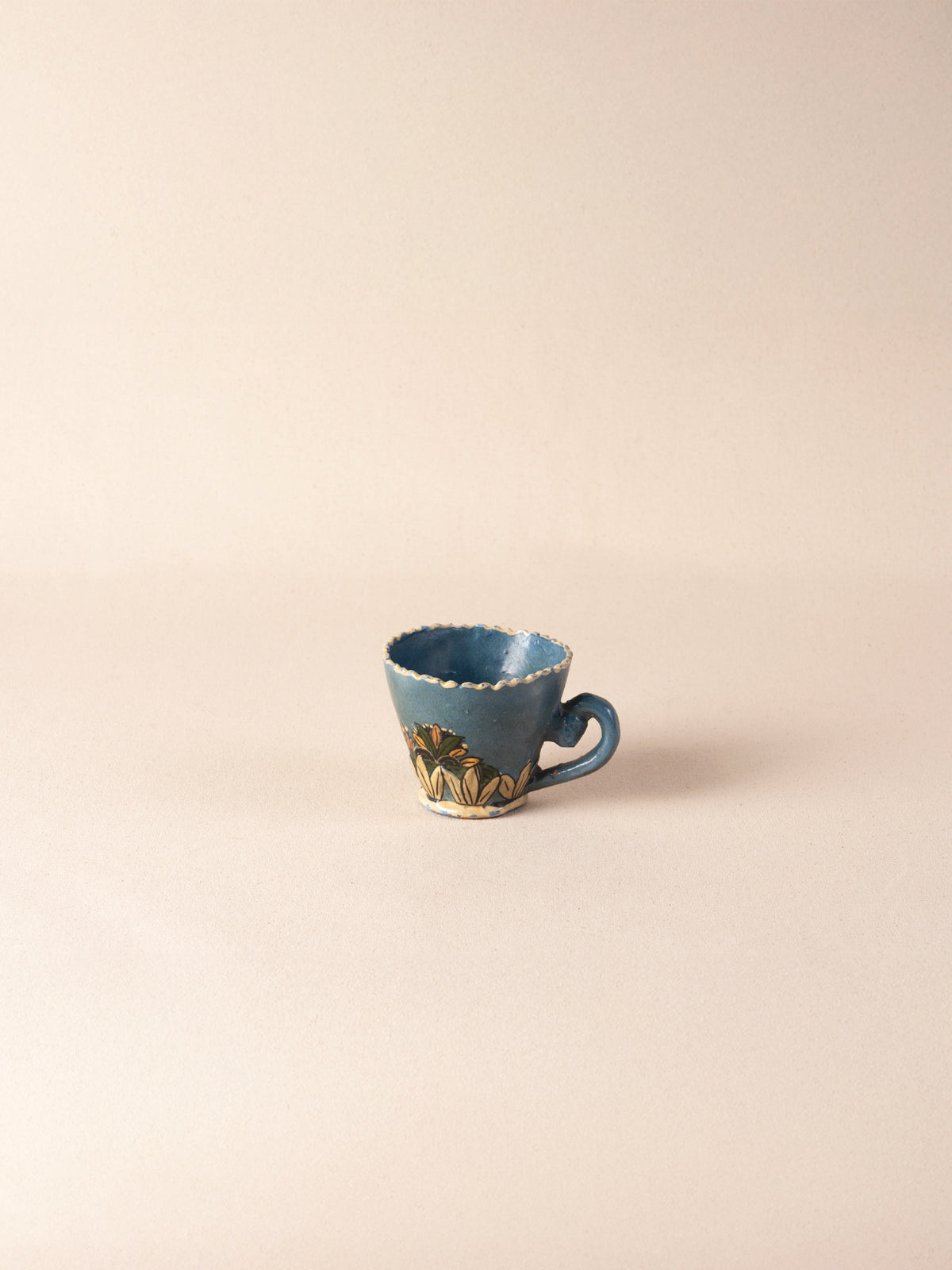 Hand-painted vintage Mexican ceramic teacup with blue decoration