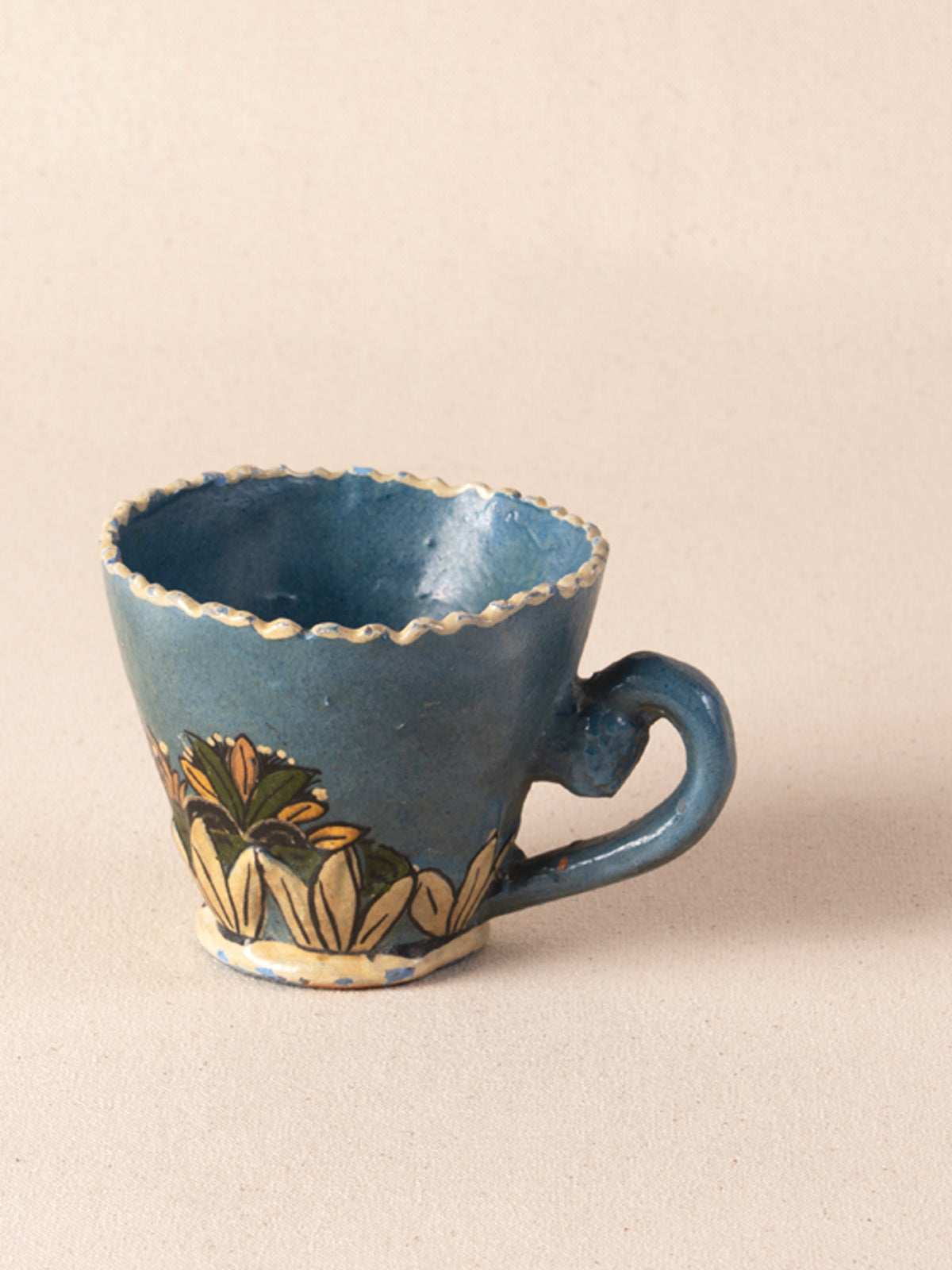 Hand-painted vintage Mexican ceramic teacup with blue decoration