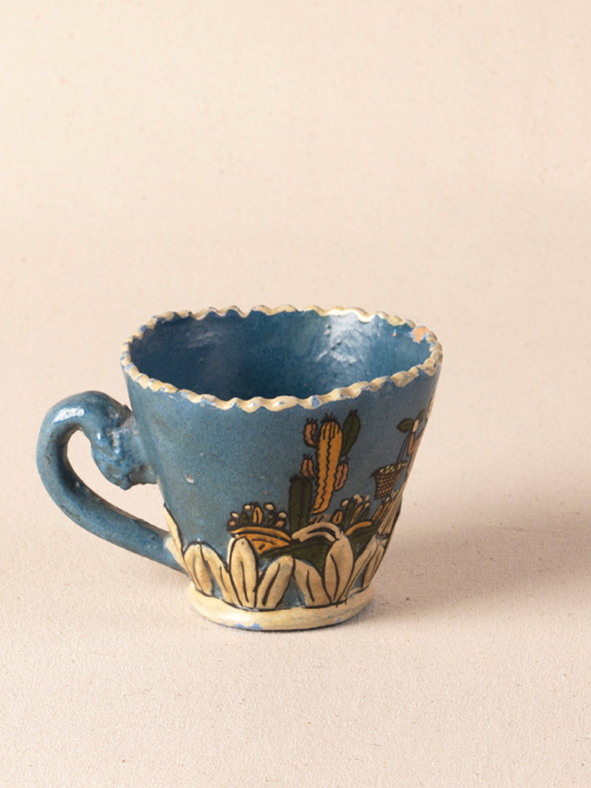 Hand-painted vintage Mexican ceramic teacup with blue decoration