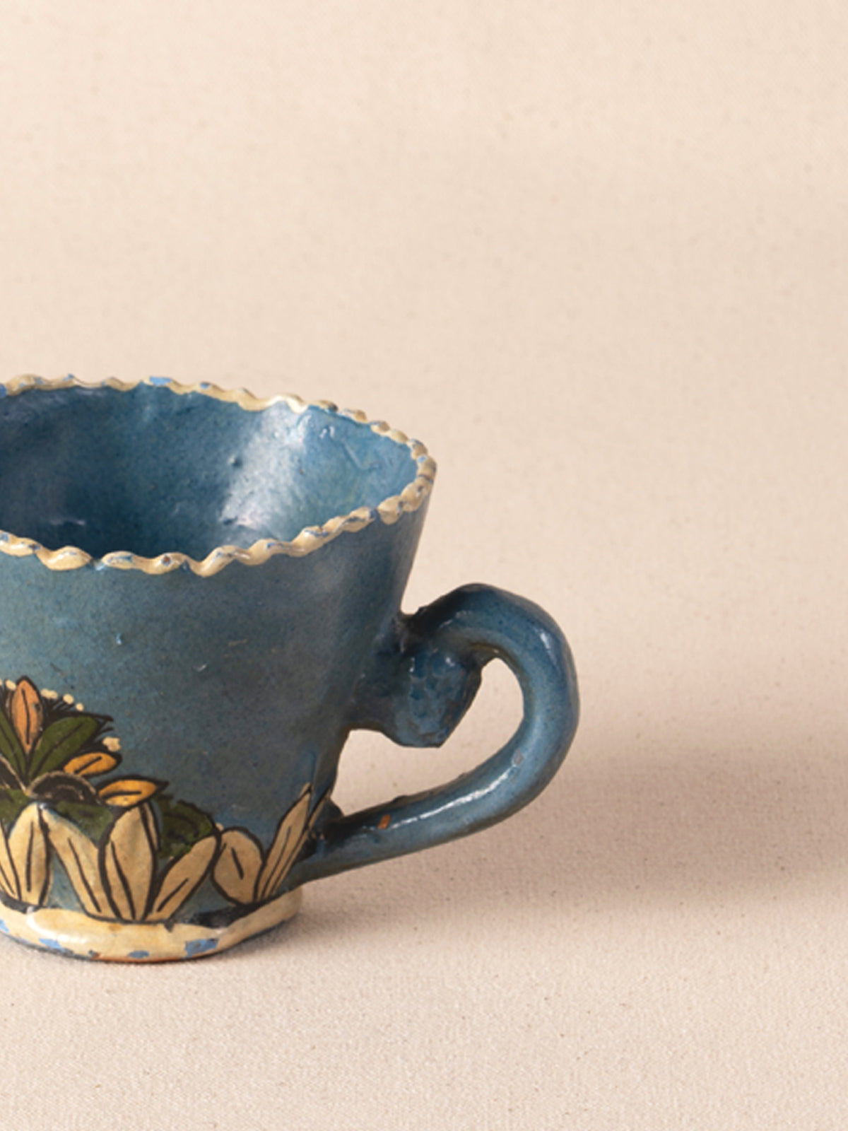 Hand-painted vintage Mexican ceramic teacup with blue decoration