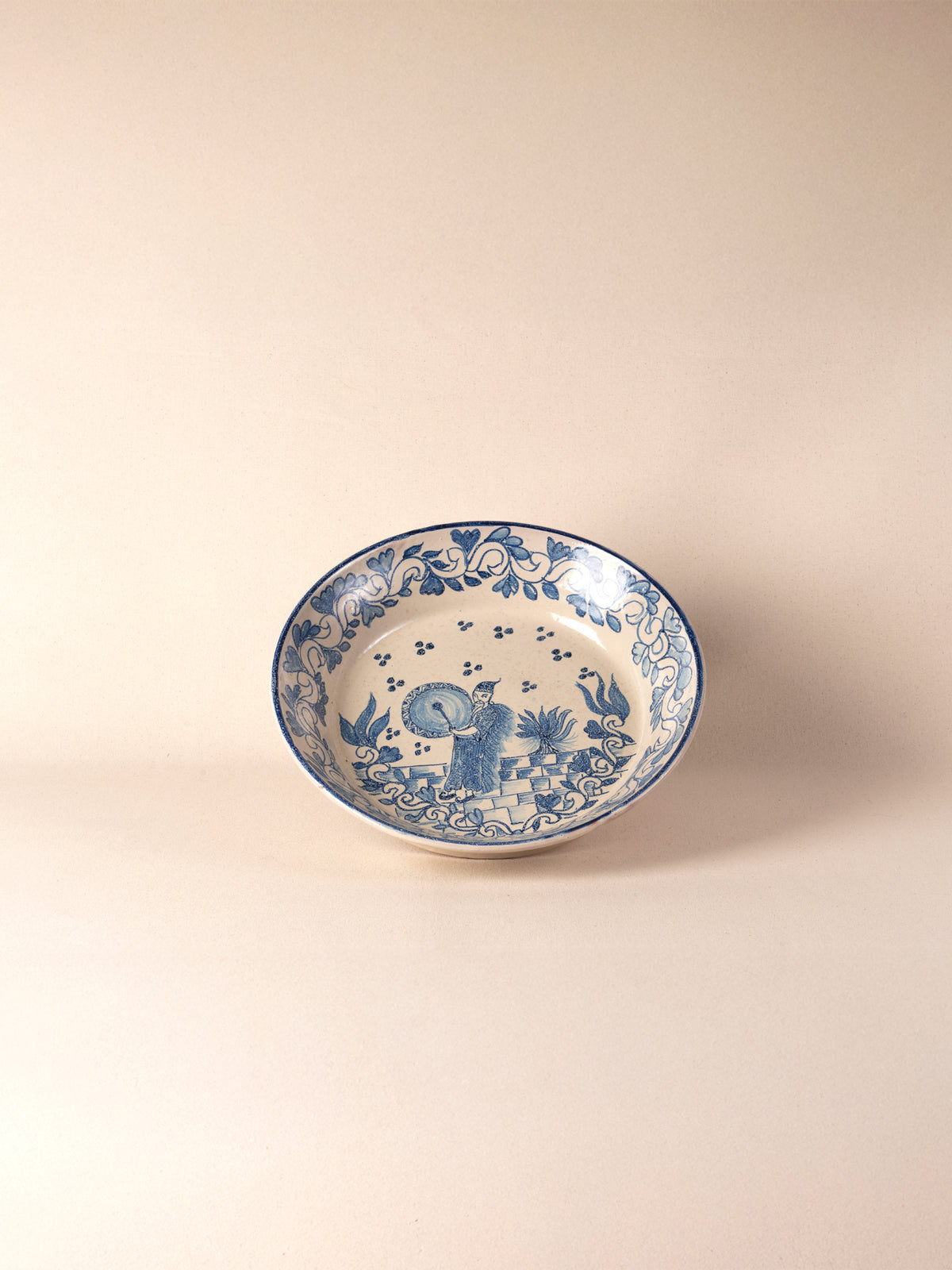 Hand-painted vintage Mexican round ceramic dish with a blue design