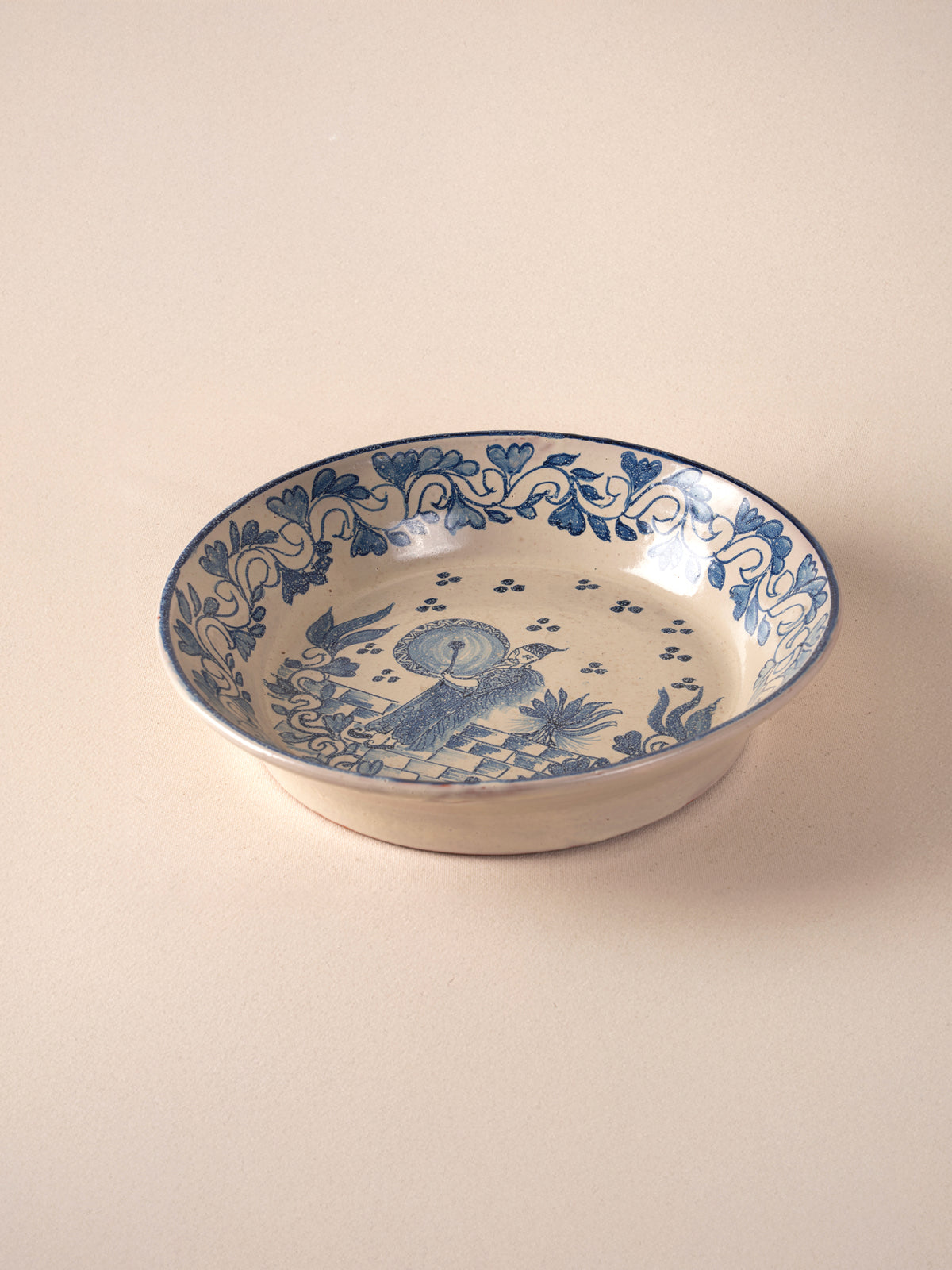 Hand-painted vintage Mexican round ceramic dish with a blue design