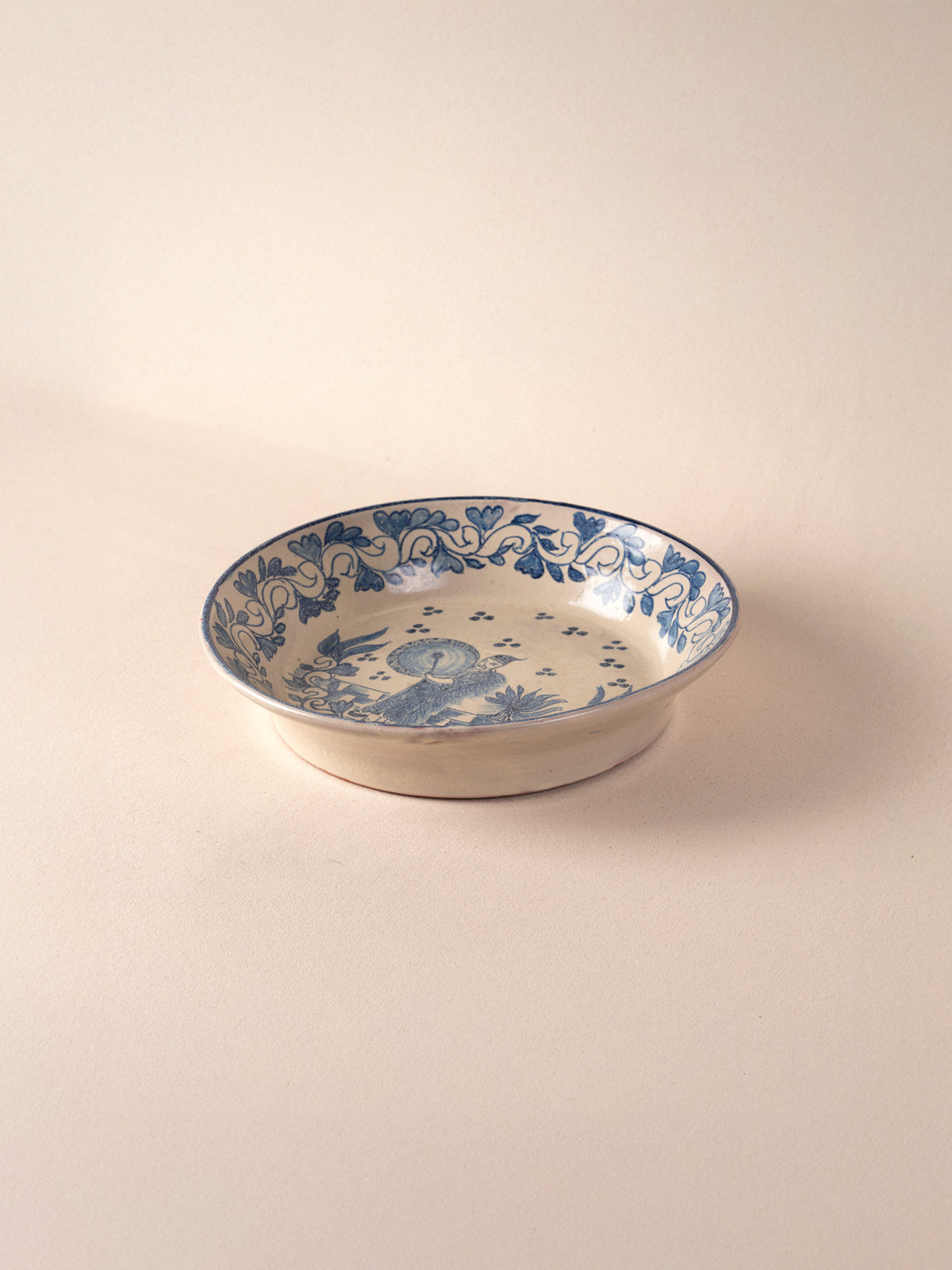 Hand-painted vintage Mexican round ceramic dish with a blue design