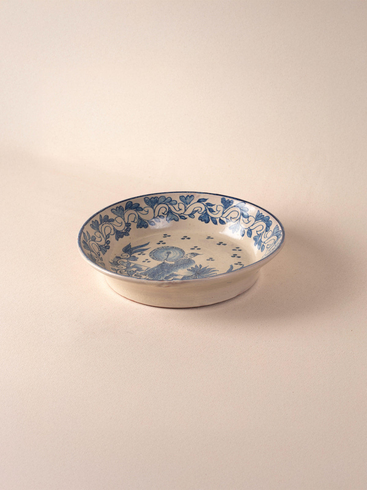 Hand-painted vintage Mexican round ceramic dish with a blue design