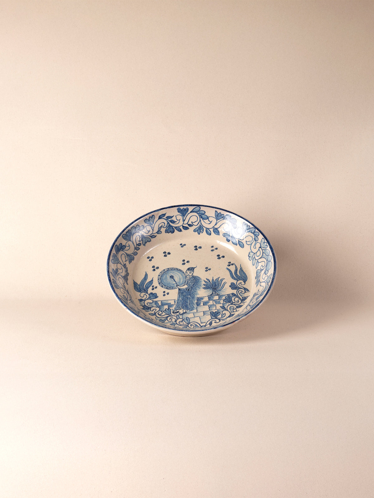 Hand-painted vintage Mexican round ceramic dish with a blue design