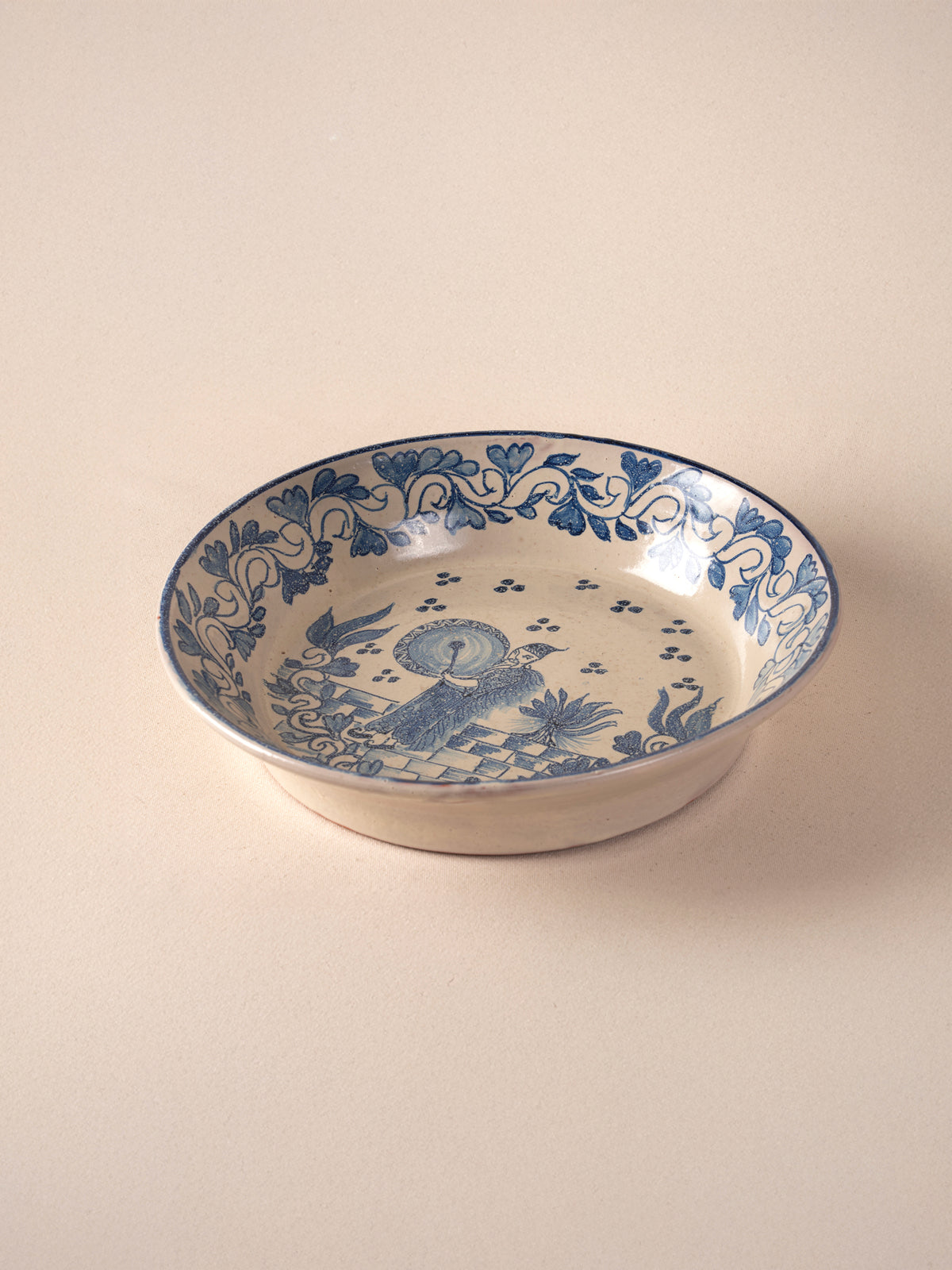 Hand-painted vintage Mexican round ceramic dish with a blue design