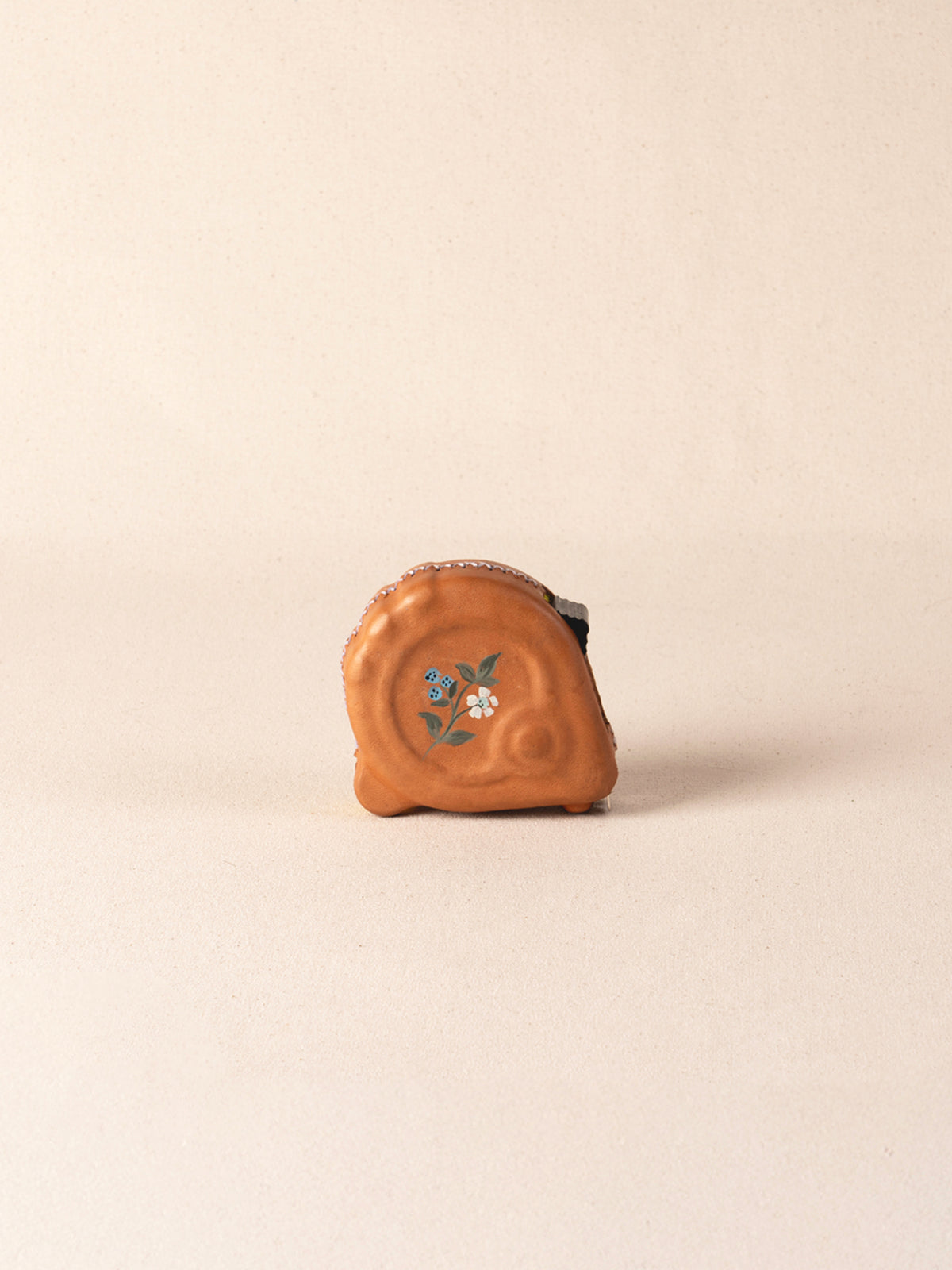 Hand-painted leather-covered 25-foot tape measure