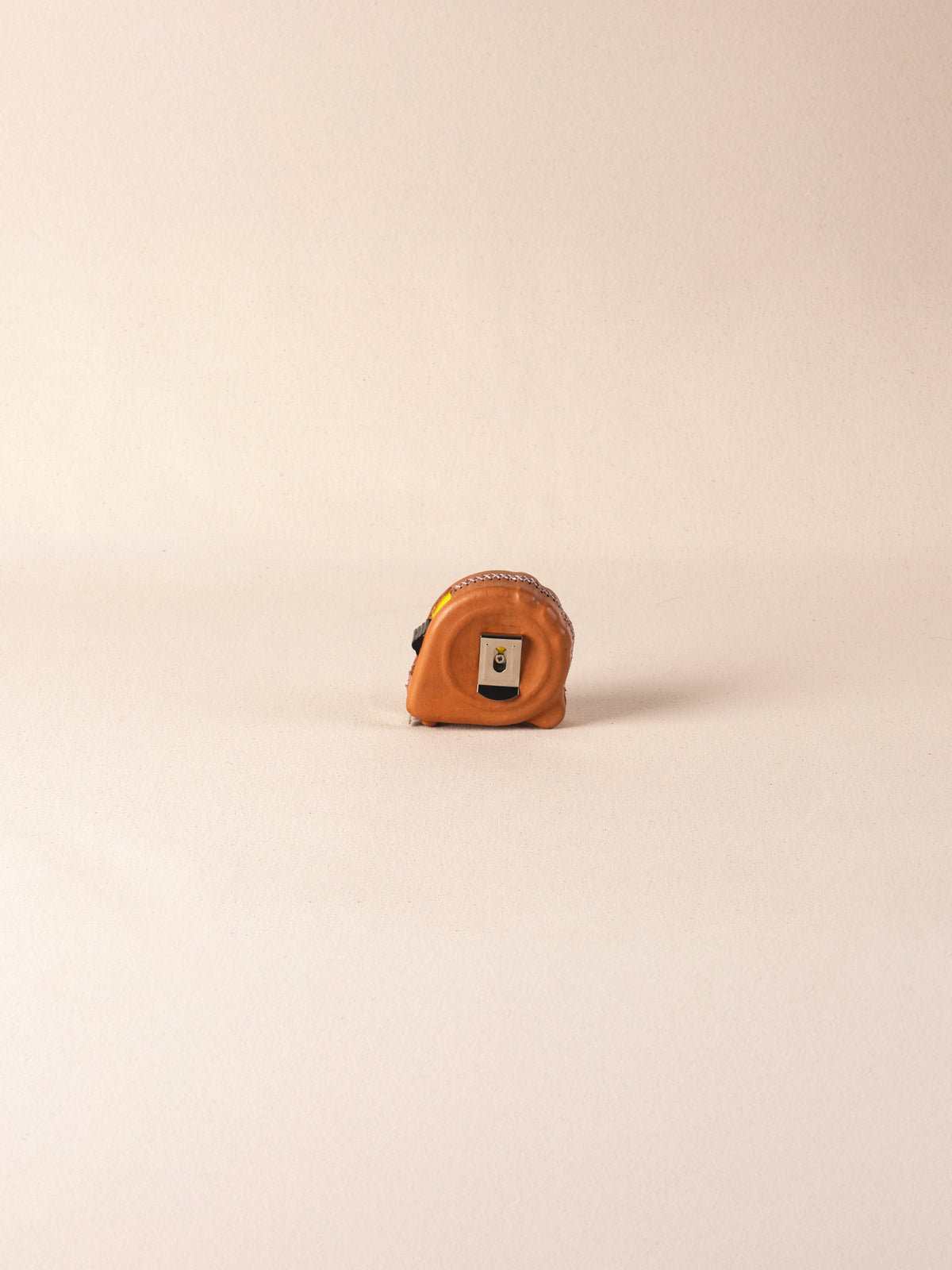 Hand-painted leather-covered 25-foot tape measure
