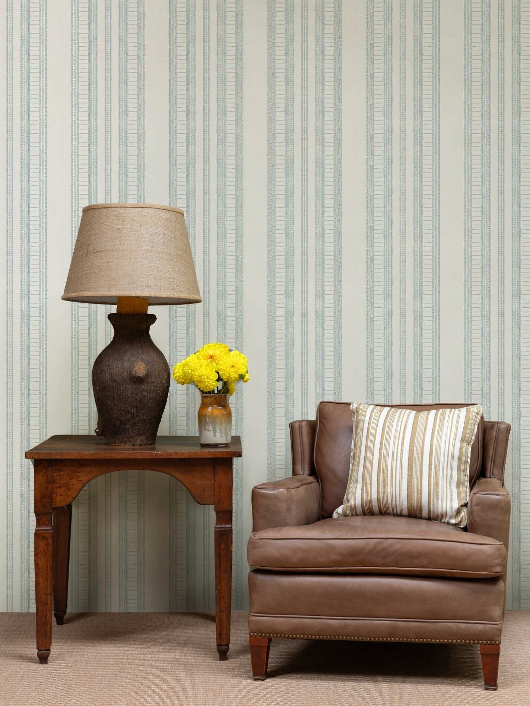 Seafoam blue and white vertical striped wallpaper pattern on wall
