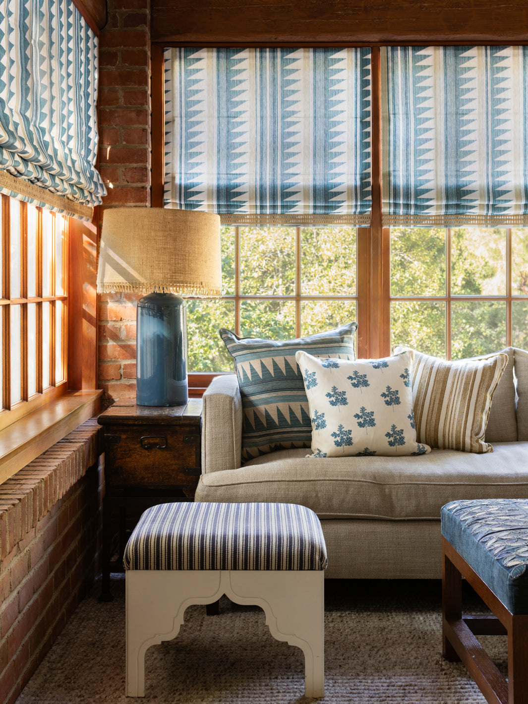 Blue linen striped fabric on curtains and accent pillows