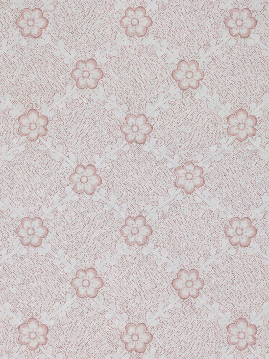 Pink linen fabric close-up with small flower motifs