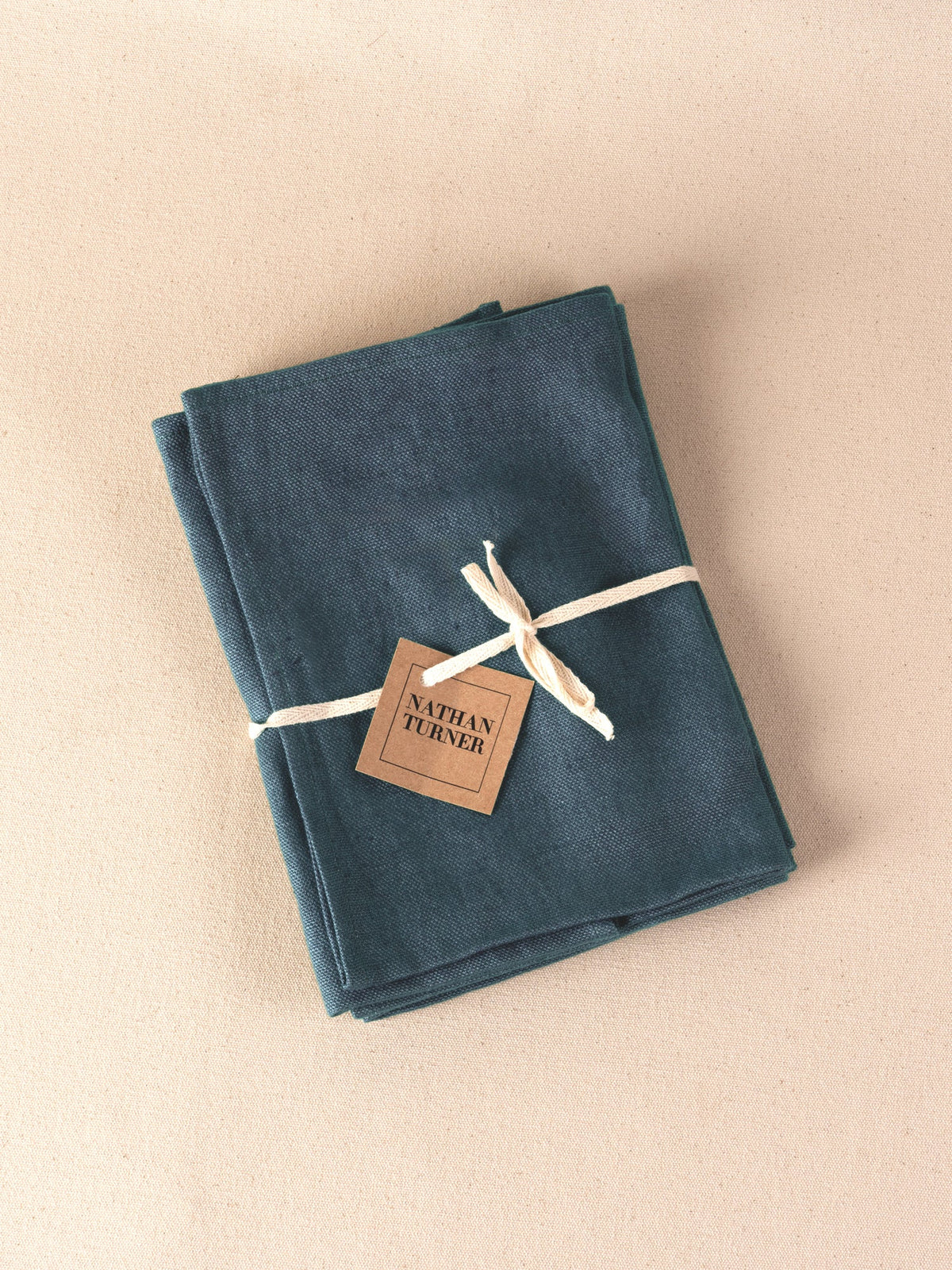 Solid blue napkins, set of 4, tied with a Nathan Turner tag