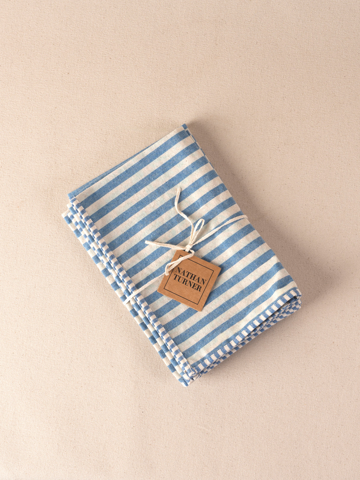 Blue and white stripe cotton napkins, set of 4, tied with a Nathan Turner tag