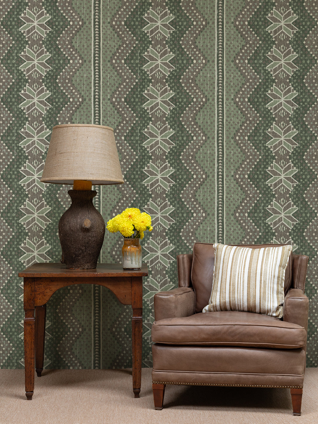 Moss brown wallpaper with repeating snowflake icons, zigzag pattern, and stripe border
