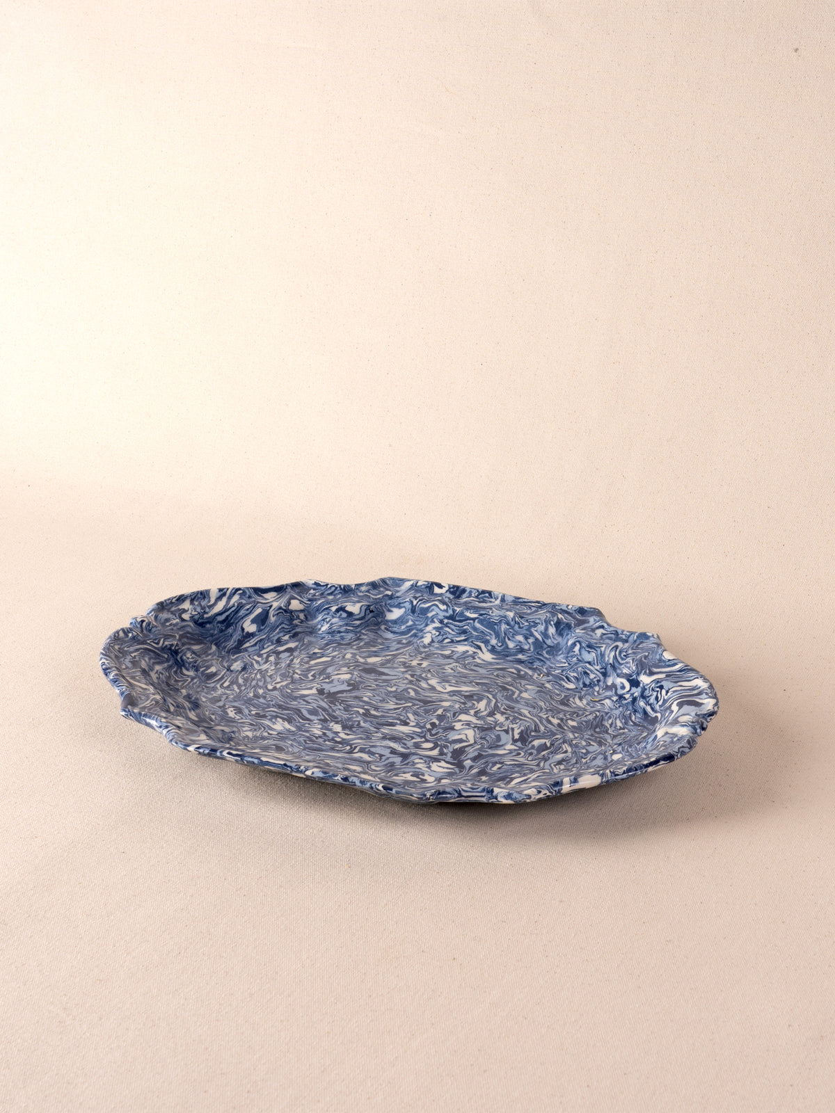 Blue and white marbled oval ceramic platter by Pascale Mestre