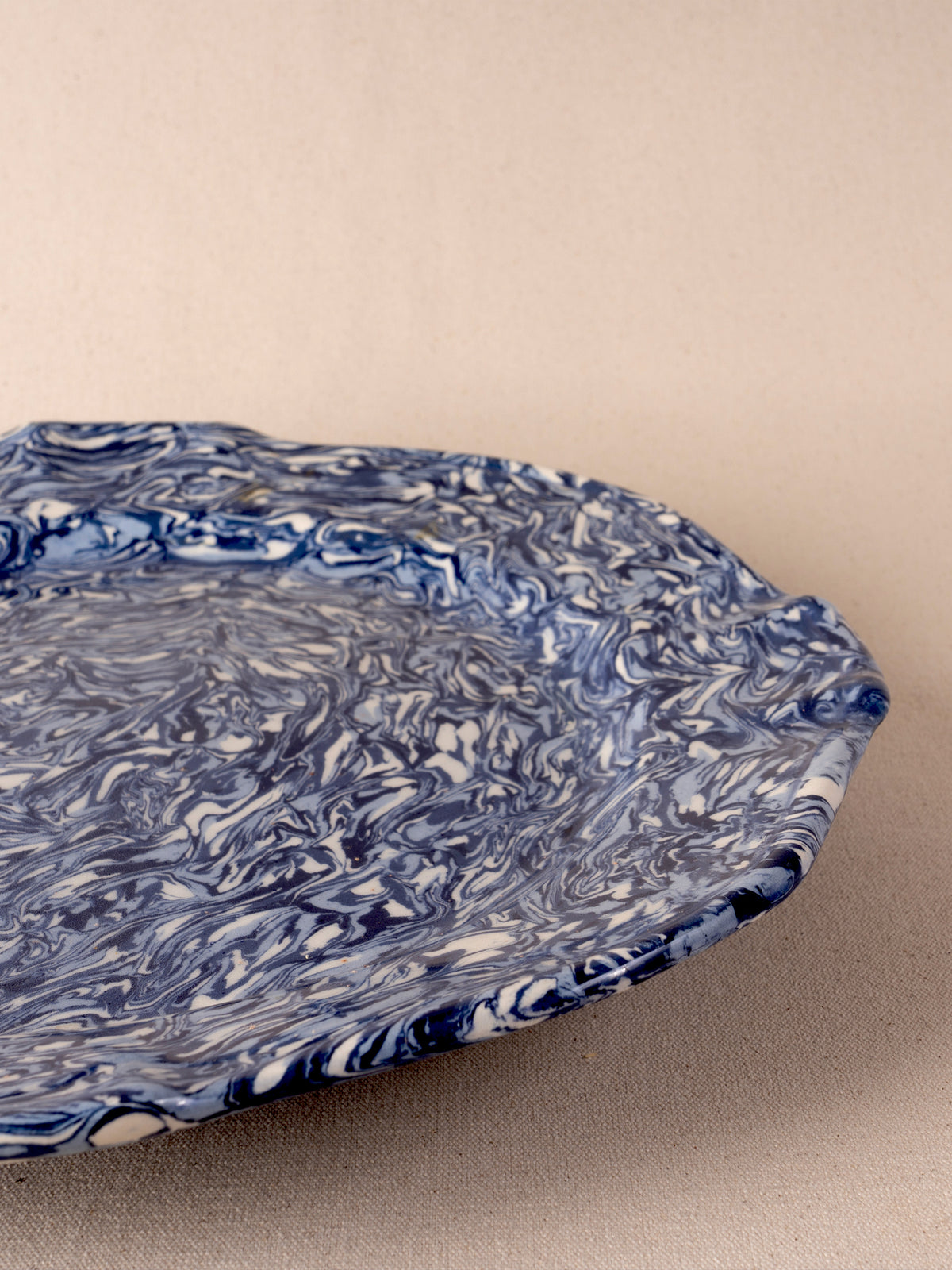 Medium blue and white marbled oval ceramic platter by Pascale Mestre