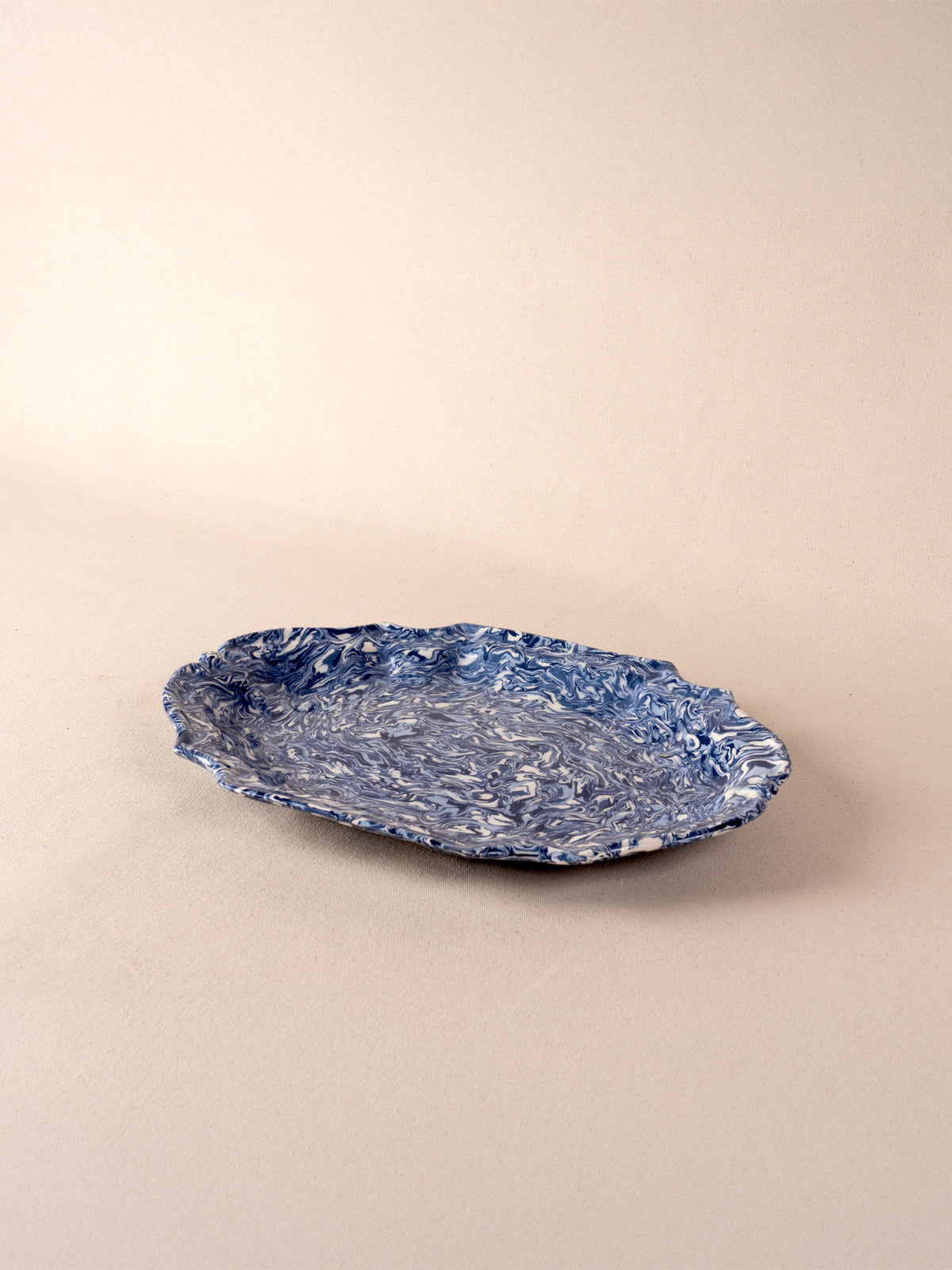 Medium blue and white marbled oval ceramic platter by Pascale Mestre