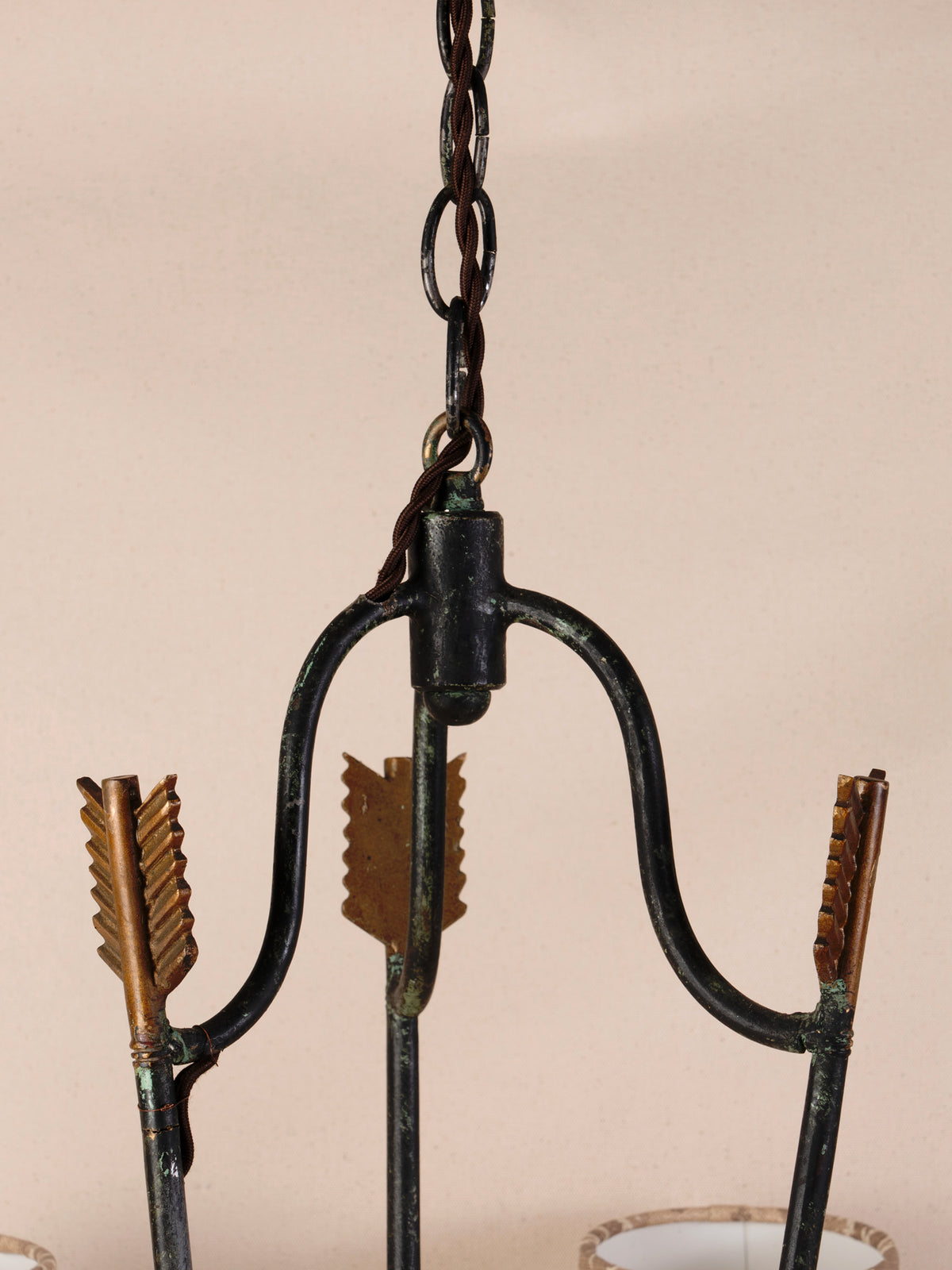 Antique three-arm dark iron chandelier with small linen shades