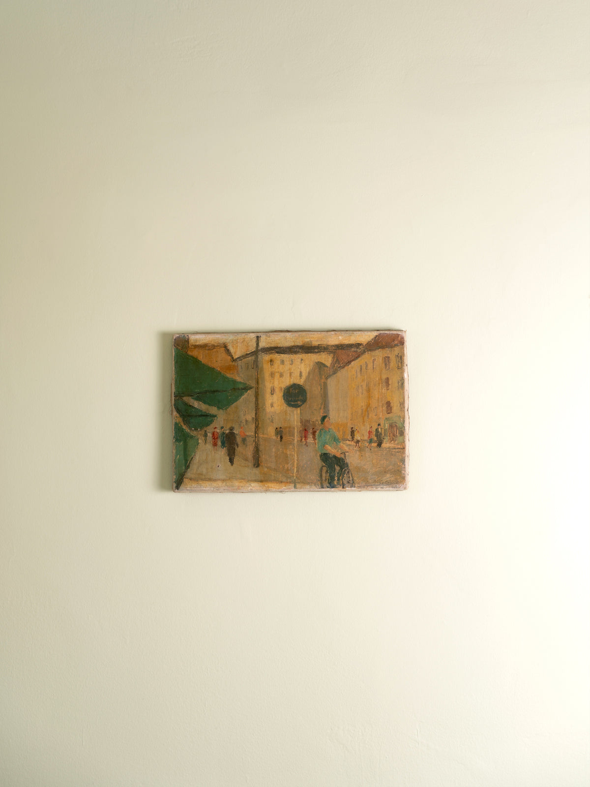Unframed oil painting of a street scene in Sweden