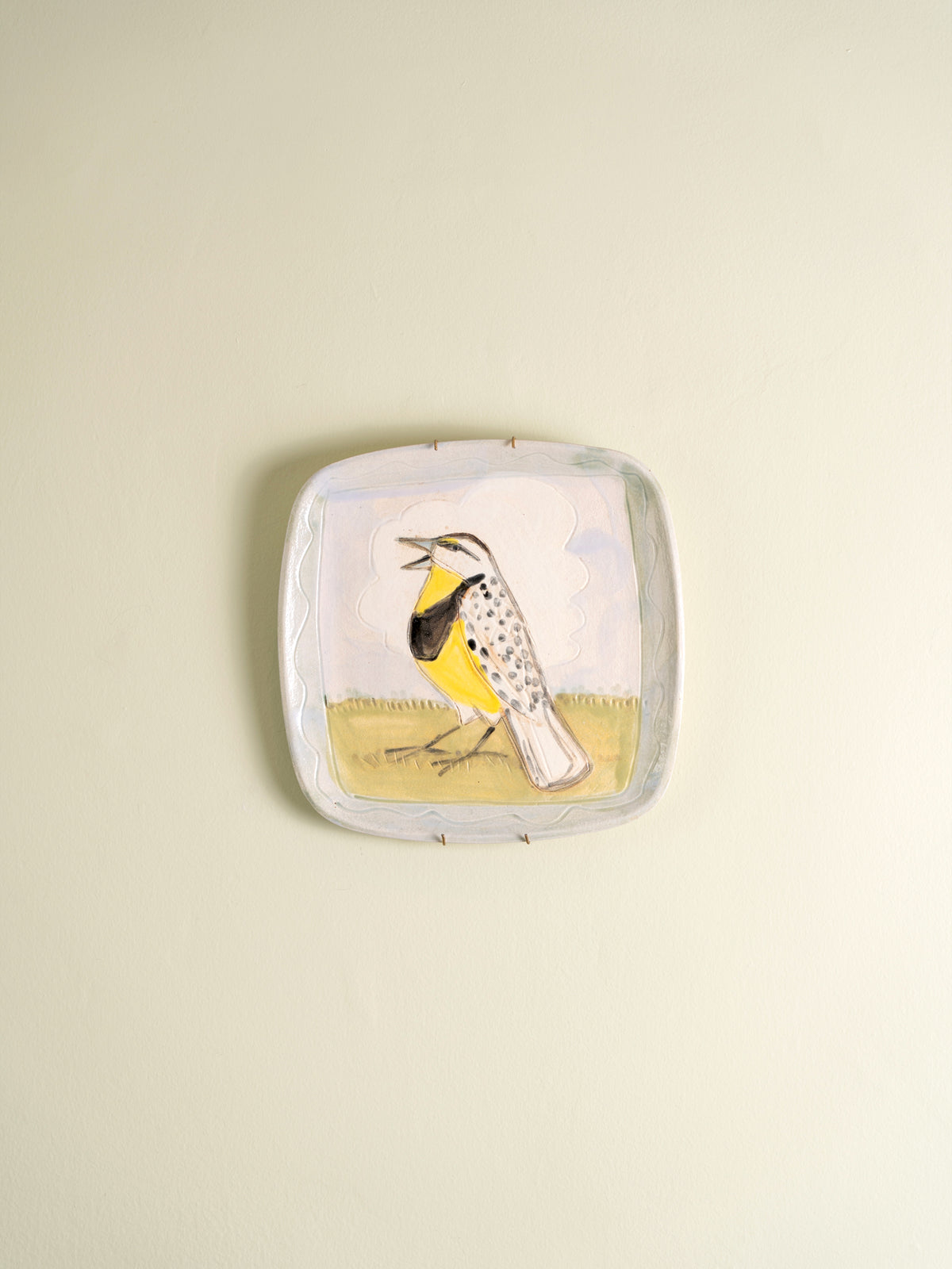 Set of four mid-century ceramic plates painted with birds and a cat
