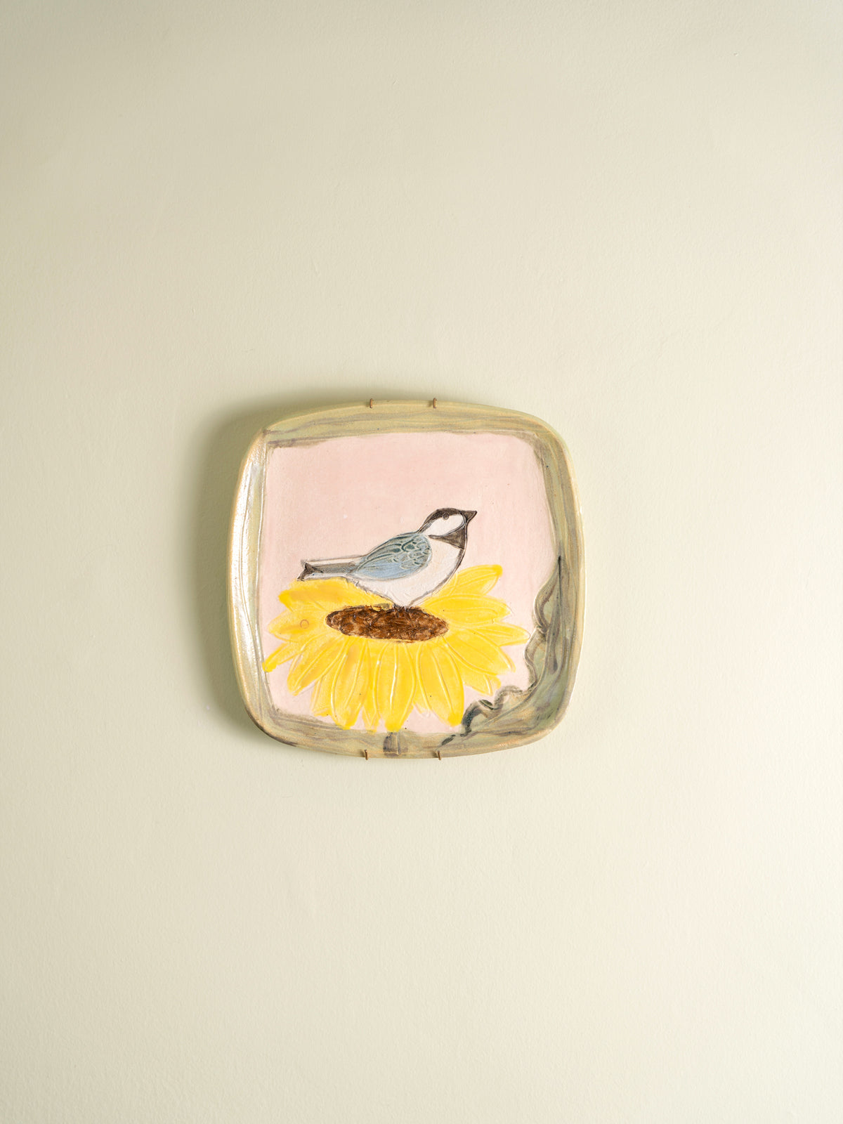 Set of four mid-century ceramic plates painted with birds and a cat