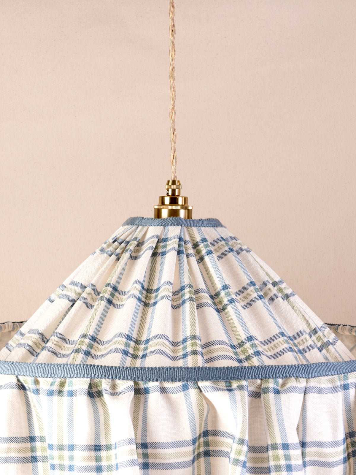 Small ruffled pendant light with blue and green Roger Plaid linen shade and blue trim
