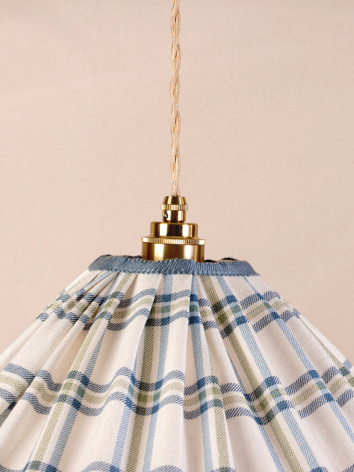 Small ruffled pendant light with blue and green Roger Plaid linen shade and blue trim
