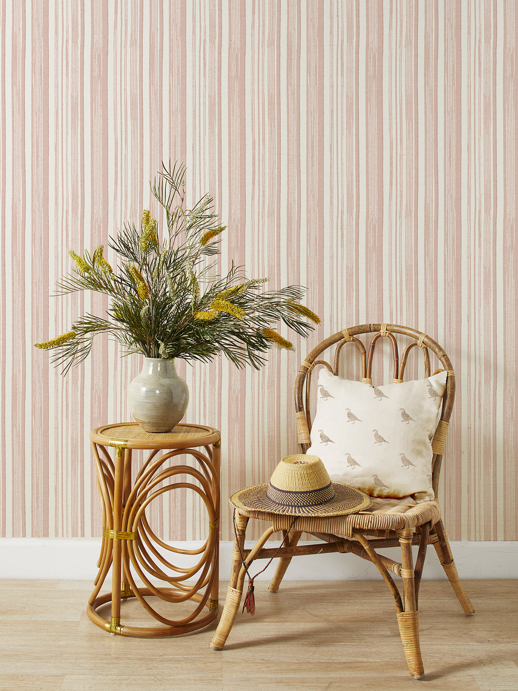 Pink and cream vertical striped grasscloth wallpaper with fine textured stripes
